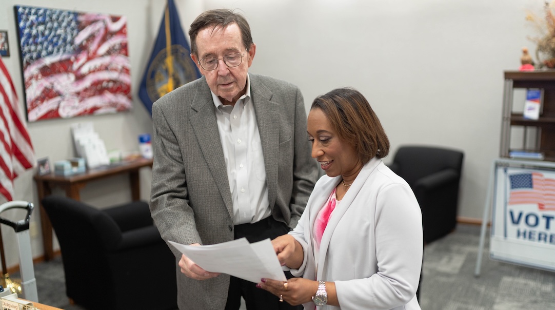 Picture of the two ballot sponsors signing the paperwork.